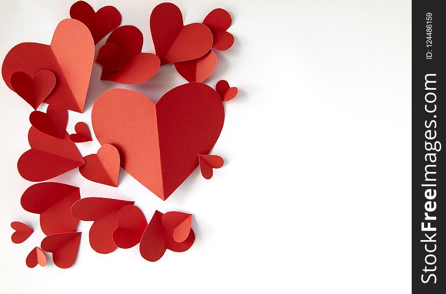 Red paper hearts on white background, copy space