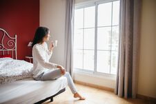 Beautiful Girl In Bed Drinking Coffee In Morning Stock Photography