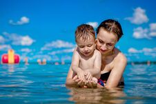 Young Mother With A Little Boy Playing With Water On The Lake In The Summer, Family Happiness, Country Family Rest, Summer Warm Da Stock Images