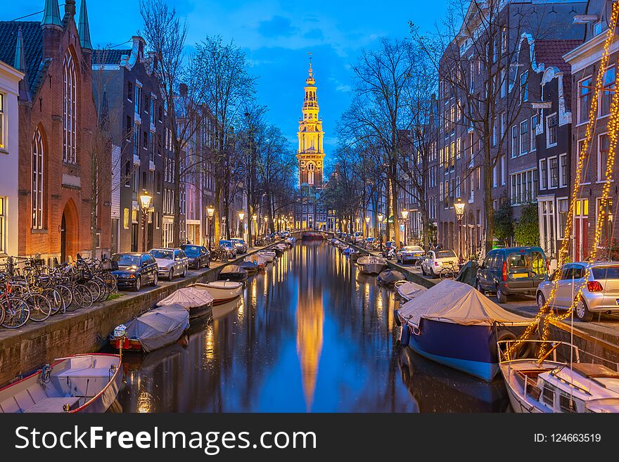 View of Zuiderkerk church at night in Amsterdam city, Netherlands.