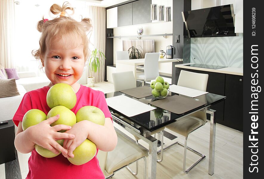 Happy little girl with apples at home. Happy little girl with apples at home