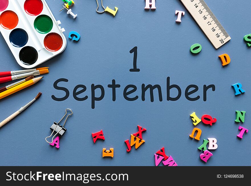 1st September. Image of september 1, calendar on blue background with office supplies. Back to school concept