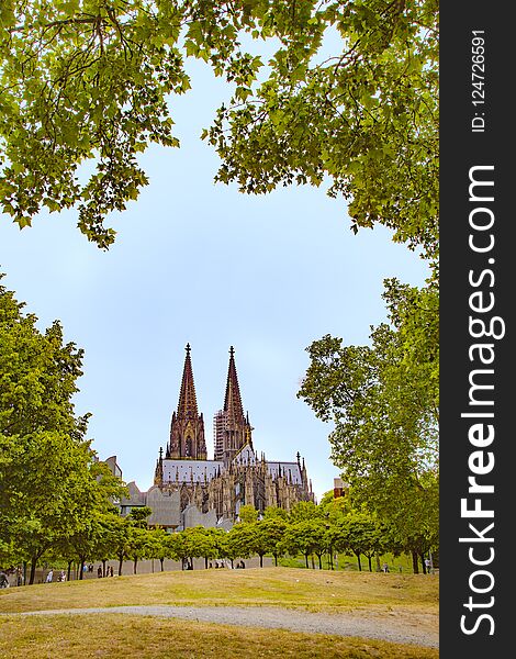 Dome in cologne seen from park under blue sky