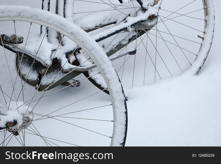 Bike wheels in the snow in Amsterdam
