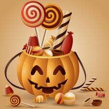 Halloween Pumpkins Basket And Collected Candy Royalty Free Stock Images