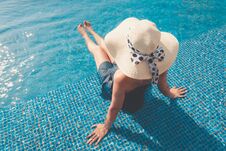 Portrait Of Asian Woman Relaxing In Swimming Pool With Sunbathe Stock Photography