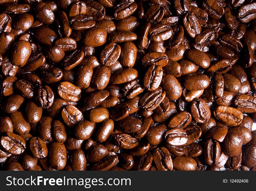 Coffee beans background in dark brown colors