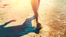 Freedom And Happines Travel Adventure Scout Concept. Unrecognizable Girl Is Walking Along The Beach In Summer Day Stock Photography