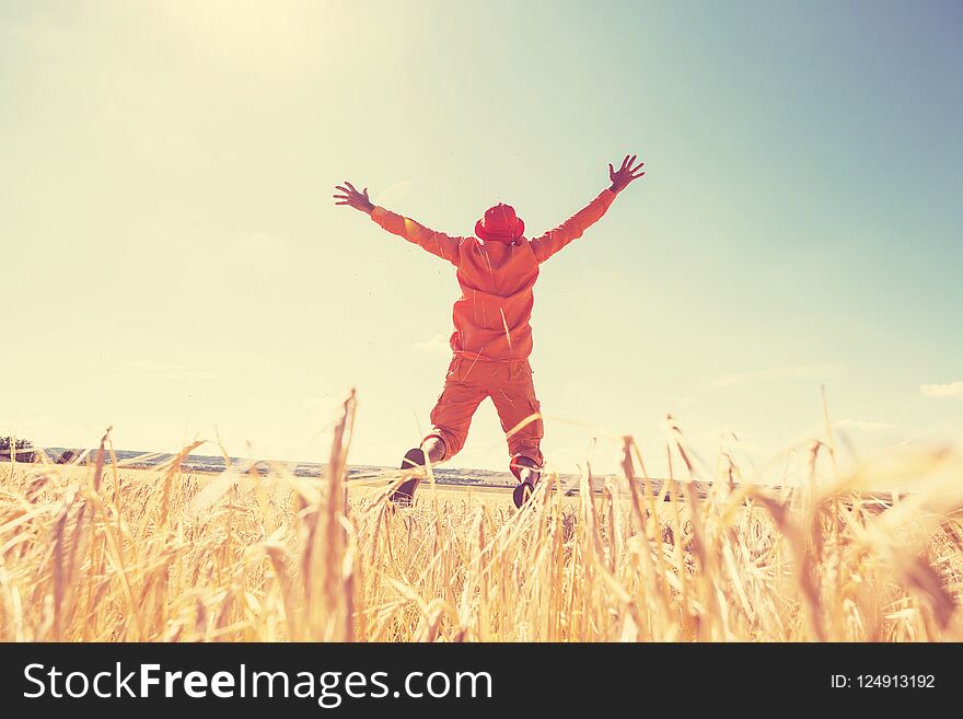 Happy man in yellow wheat field