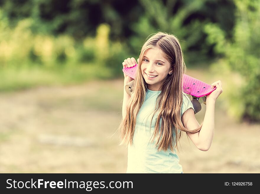 Teenage girl holding her pink board