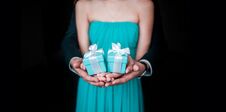 Guy With Girl Holding Wedding Gift In Hands And Showing In Frame Royalty Free Stock Photo