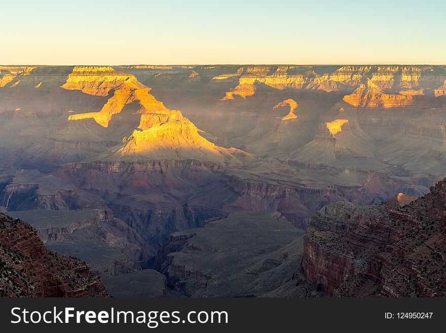 Grand Canyon sunrise with blue and red hues in the sky. Grand Canyon sunrise with blue and red hues in the sky
