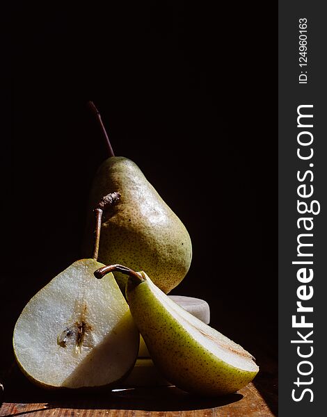 Ripe pears on dark background. place for text