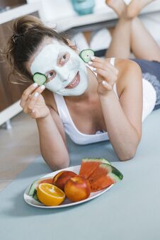 Young Pretty Blonde Woman With Towel On Head And Facial Mask Wit Stock Photography