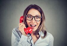 Portrait Of A Happy Amazed Woman Talking On The Red Phone Stock Photos Portrait Of A Happy Amazed Woman Talking On The Red Phone Stock Photos