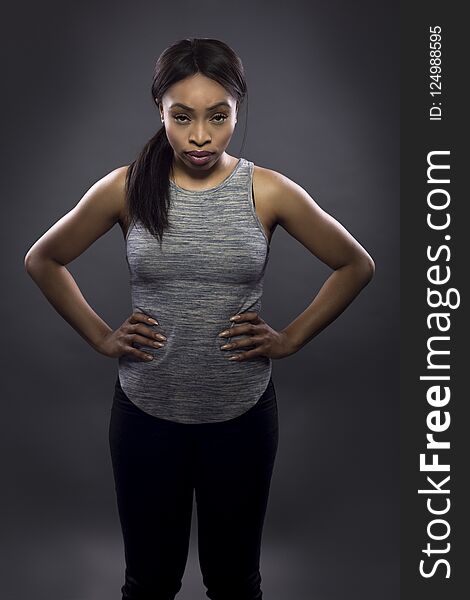 Black Fitness Trainer on a Dark Grey Background