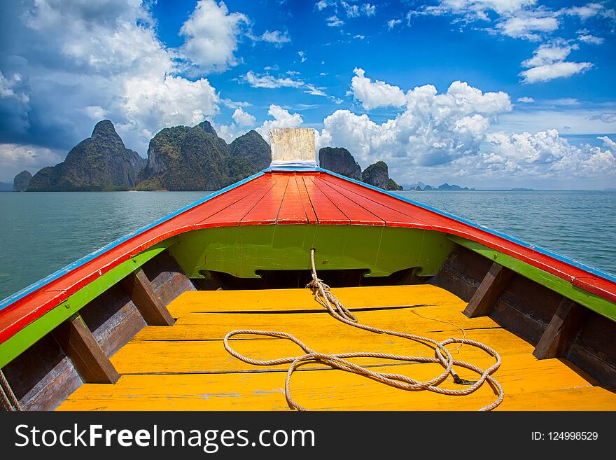 Boat trip to tropical islands from Phuket, Krabi in Thailand. Green mountains and blue water lagoon