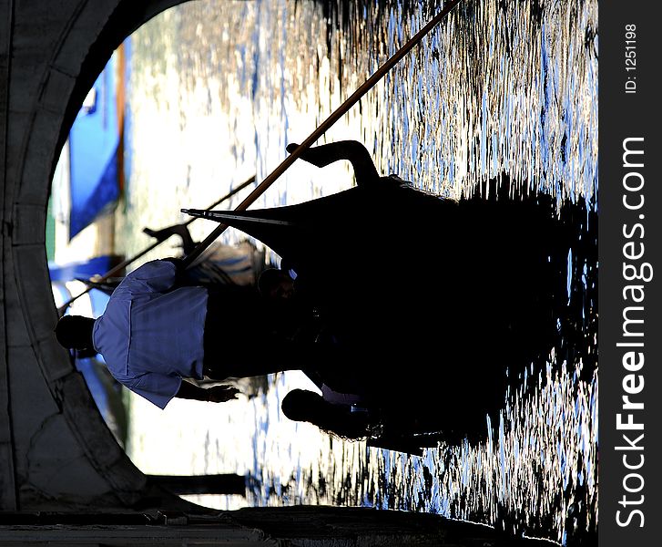 Part of the make-up of Venice are the Gondolas and the Gondaliers. With some canals being dark, they can make great silhouettes. Part of the make-up of Venice are the Gondolas and the Gondaliers. With some canals being dark, they can make great silhouettes.