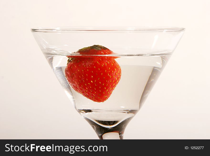 Strawberry Martini with strawberry dropped in