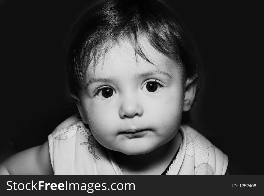 Baby portrait over black background