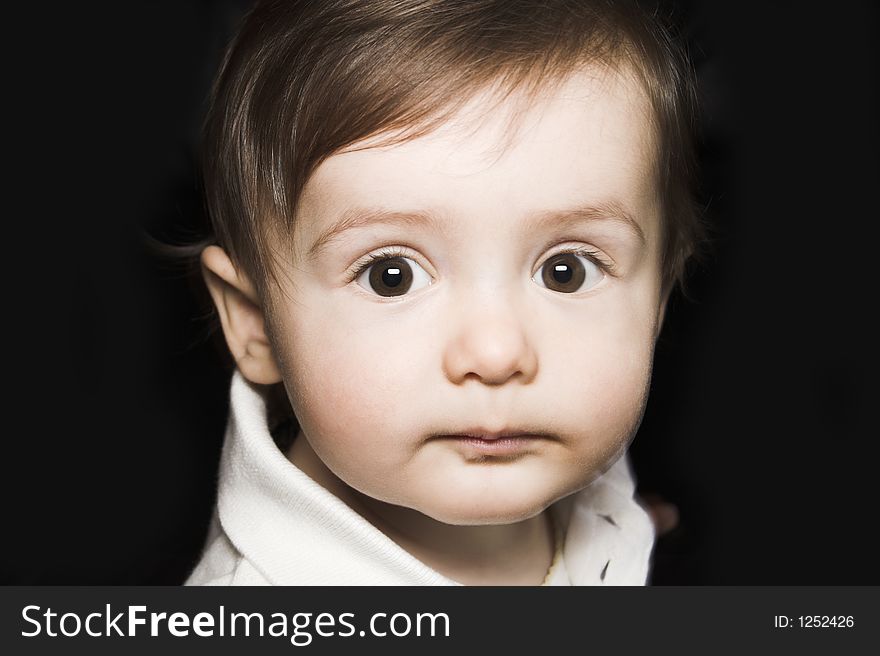 Baby portrait over black background