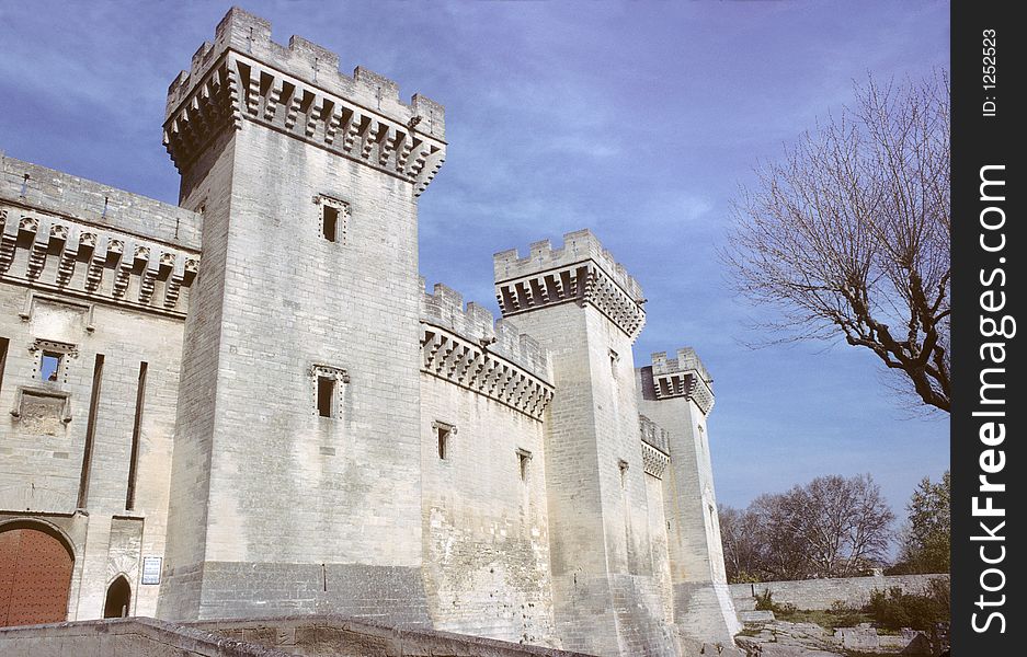 Castle of tarascon, france, showing battlements with ramparts, big square towers and machicolations. Castle of tarascon, france, showing battlements with ramparts, big square towers and machicolations