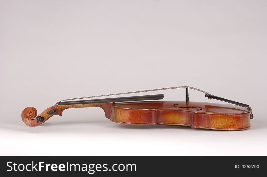 Isolated View of an Antique Violin on its' Back. Isolated View of an Antique Violin on its' Back