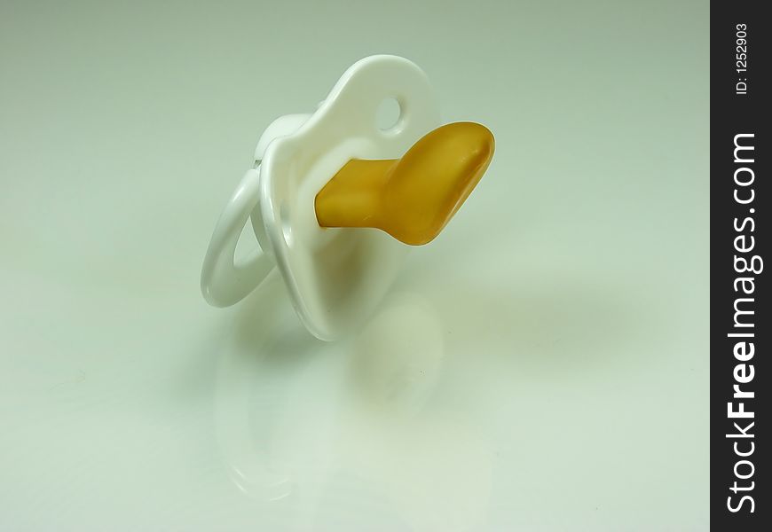 Isolated white Pacifier on neutral background. Isolated white Pacifier on neutral background.