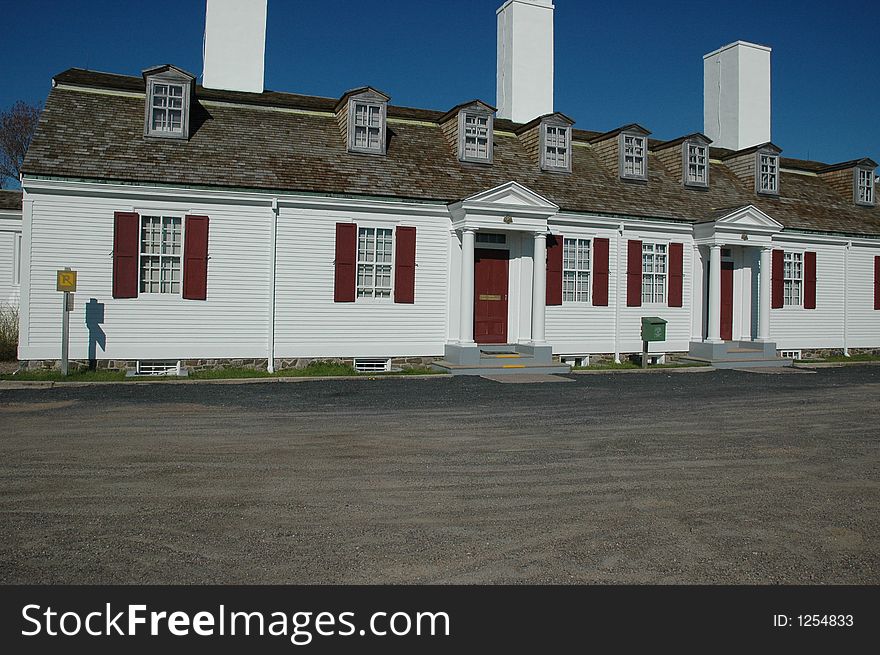 Three chimneys rise above the dormers of the Officers' Quarters at Fort Anne, a fort built in 1635 in Annapolis Royal, Nova Scotia, Canada. . Three chimneys rise above the dormers of the Officers' Quarters at Fort Anne, a fort built in 1635 in Annapolis Royal, Nova Scotia, Canada.