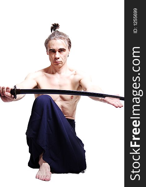 Samurai with sword. Shot in studio.