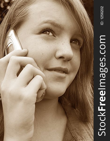 Teenage girl using cellphone outdoors