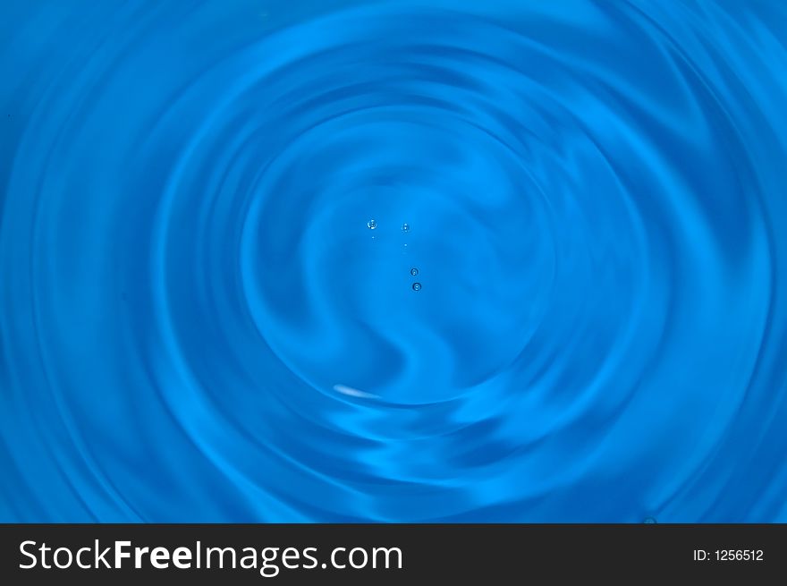 Drops of water above rippled water. Drops of water above rippled water