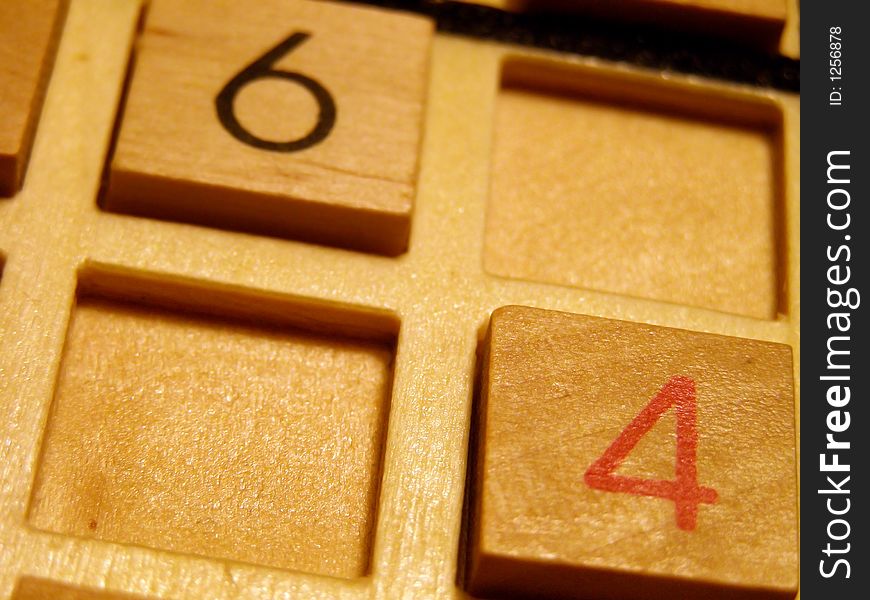 Wood sudoku board and tiles.