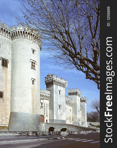 Castle of tarascon, france, showing battlements with ramparts, big round and square towers and machicolations. Castle of tarascon, france, showing battlements with ramparts, big round and square towers and machicolations