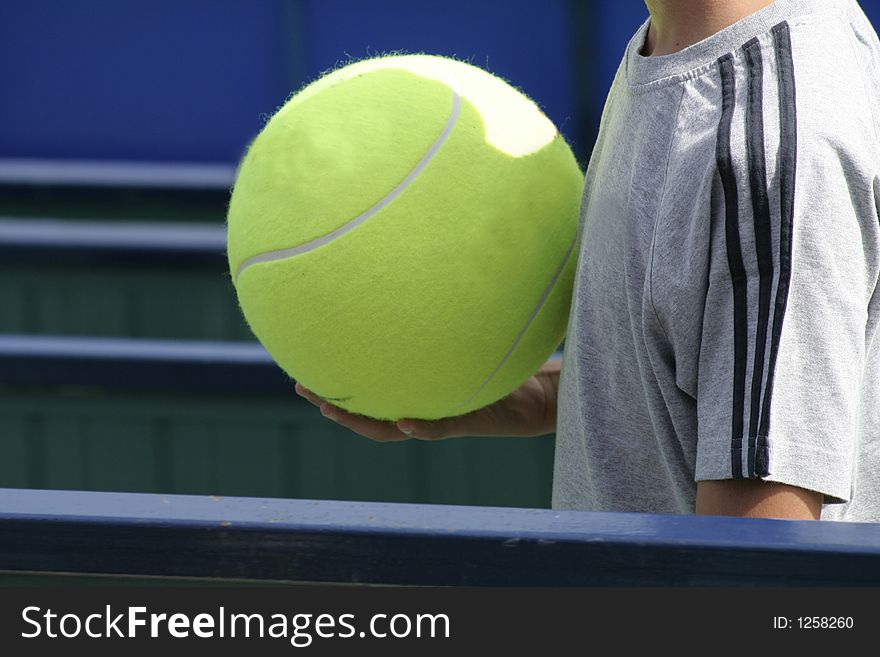 Tennis fan with a big tennis ball