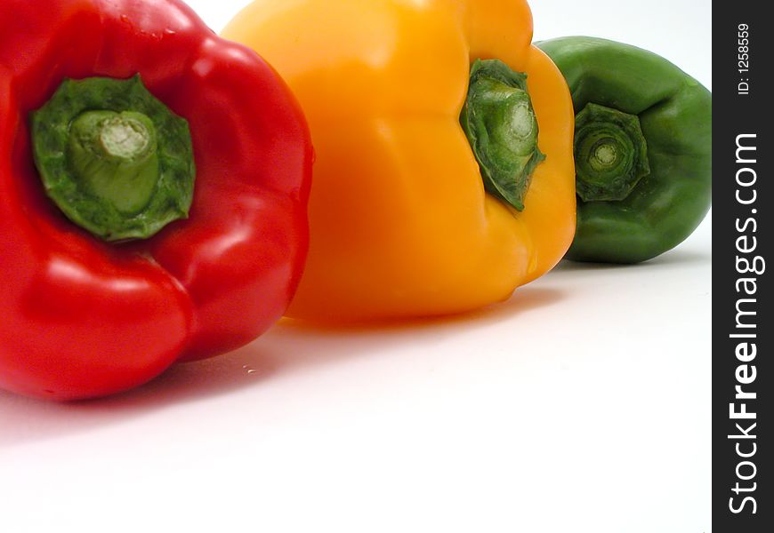 Fresh peppers on a white background