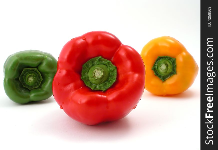 Fresh peppers on a white background