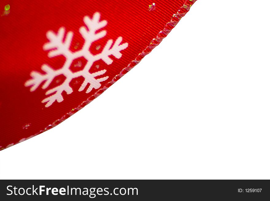 Red christmas ribbon closeup of a snowflake shallow depth of field. Red christmas ribbon closeup of a snowflake shallow depth of field