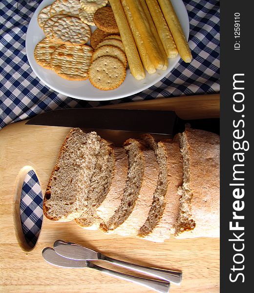 Assorted biscuits and tadicional bread on a blue and white towel. Assorted biscuits and tadicional bread on a blue and white towel