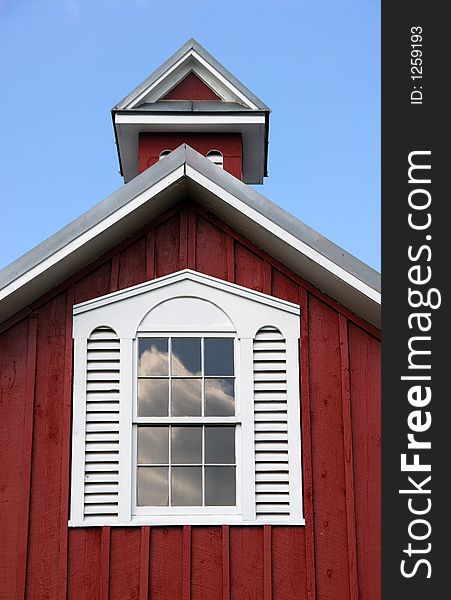 Ornate window and cupola on a country barn. Ornate window and cupola on a country barn