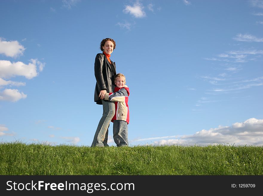 Mother with son on grass