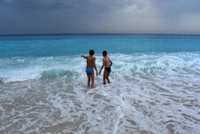 Two Boys In The Sea Watched The Waves. Stock Image