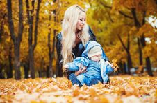 Cute Little Boy With His Mother In Autumn Park. Stock Photos
