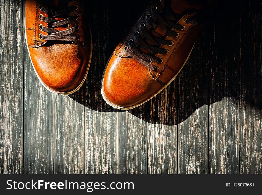 Brown Leather Shoes On Wooden Background Top View With Copy Space