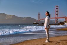 Woman On Beach Near Golden Gate Bridge Stock Image