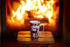 Cup Of Hot Chocolate And Marshmallows Near Fireplace Royalty Free Stock Images