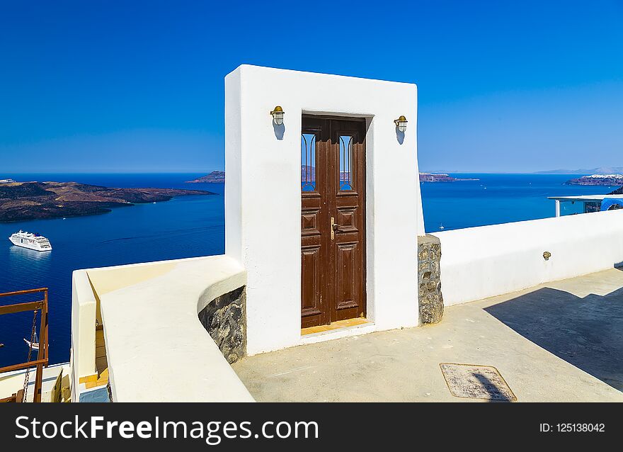 Beautiful door to the blue sea and landscape in Oia, Santorini, Greece
