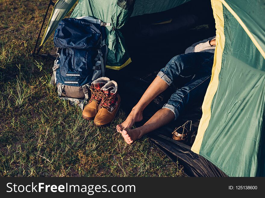 Legs Of Young Woman Inside Camping Tent