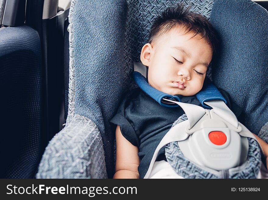 Asian Baby Boy Travel In Car Seat And Sleeping