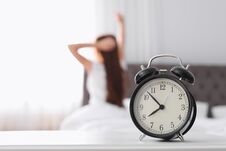 Alarm Clock On Table In Bedroom Royalty Free Stock Images